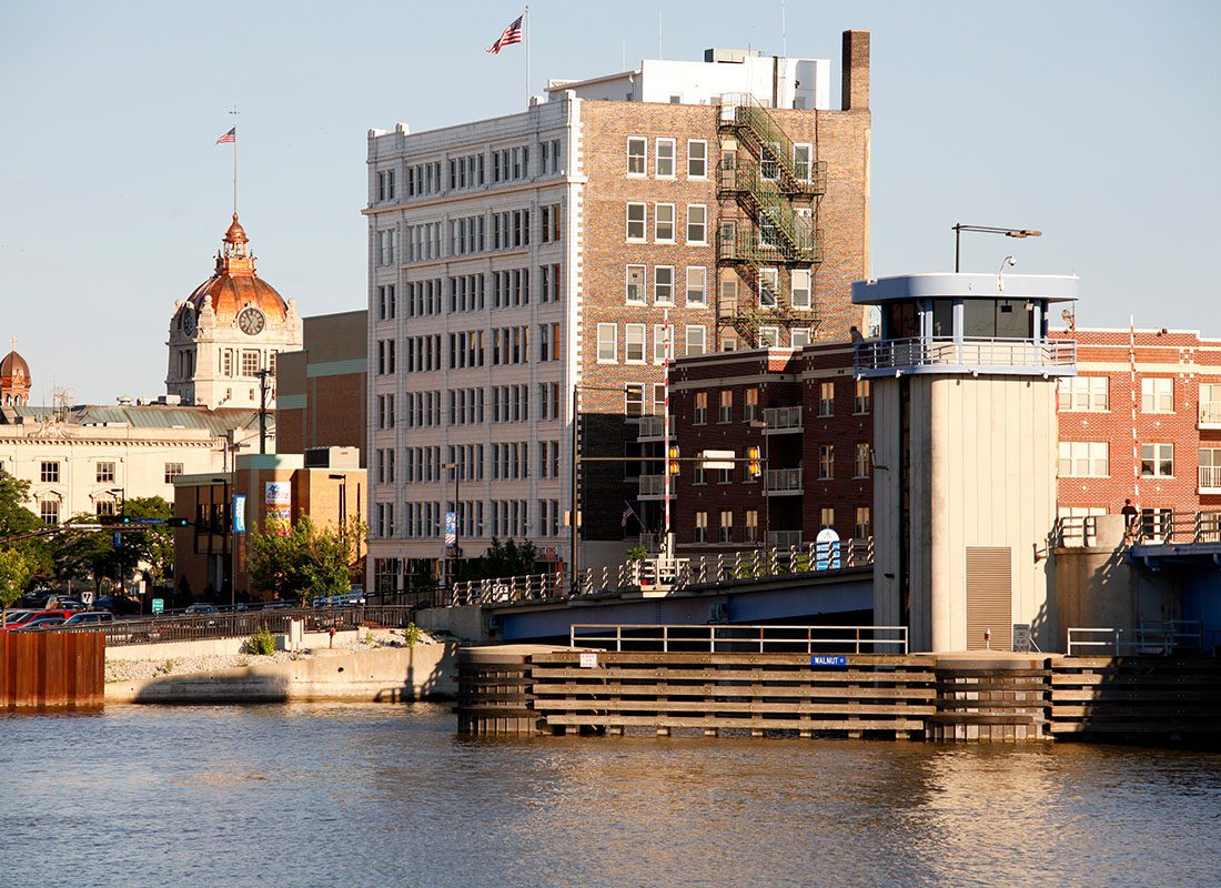 Green Bay, WI - View of Commercial and Apartment Buildings in Downtown Green Bay Wisconsin Next to the River on a Sunny Day