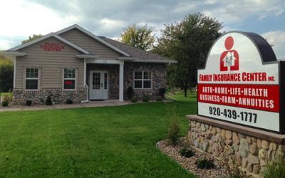 Stockbridge, WI - Exterior View of the Family Insurance Center Office Building and Sign in Stockbridge Wisconsin with a Manicured Front Lawn